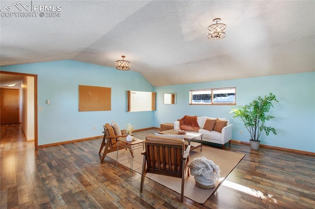 living room featuring dark hardwood / wood-style flooring and vaulted ceiling