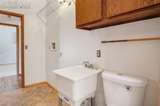 washroom with sink and washer hookup