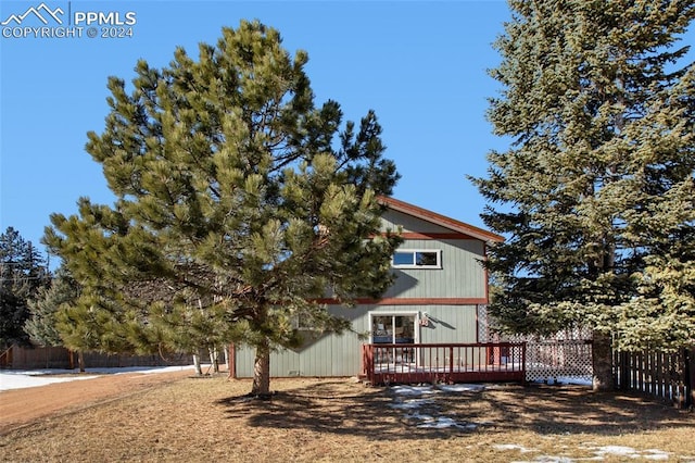 exterior space featuring a wooden deck