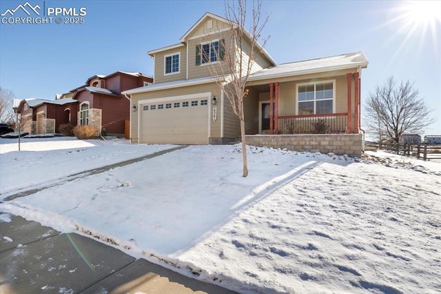 view of property with a porch and a garage