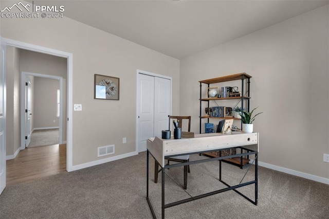 office area with light colored carpet