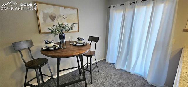 dining area featuring carpet flooring