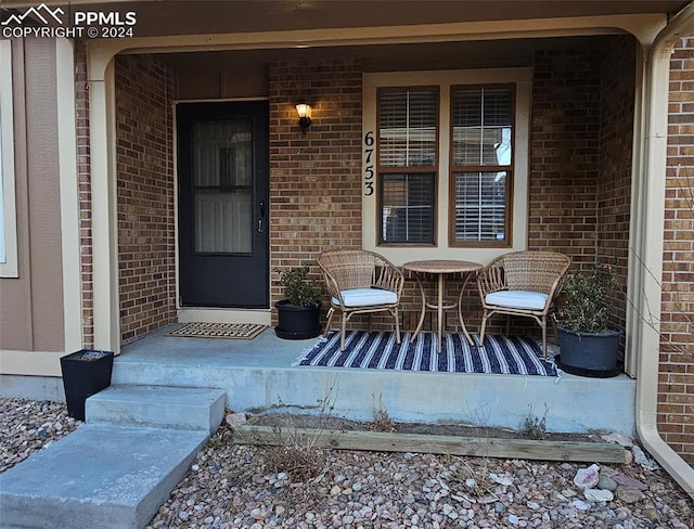 property entrance featuring covered porch