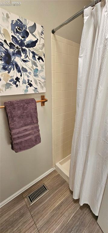 bathroom with a shower with curtain