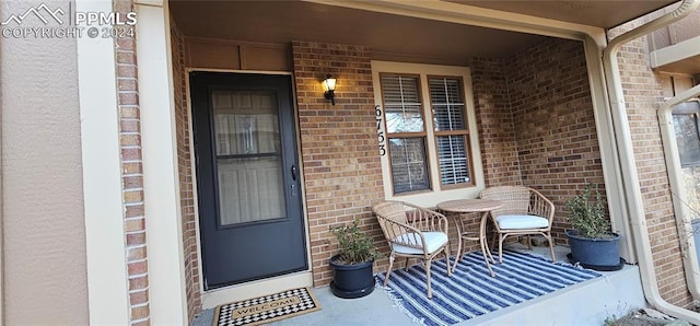 entrance to property featuring covered porch