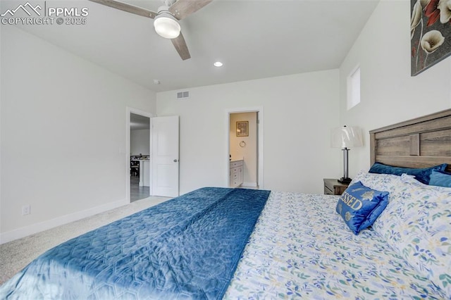 bedroom with carpet, ceiling fan, and ensuite bath