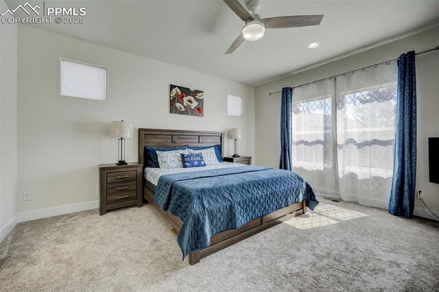 bedroom with light colored carpet and ceiling fan