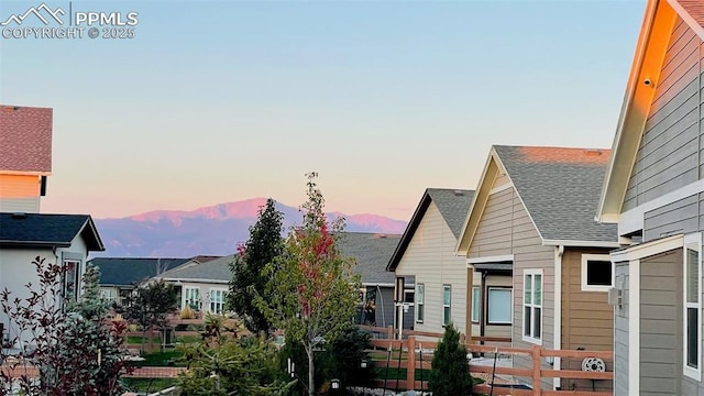 view of back house at dusk