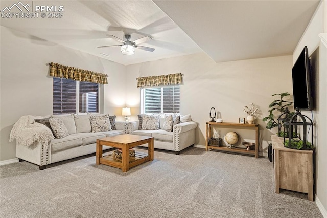 carpeted living room featuring ceiling fan