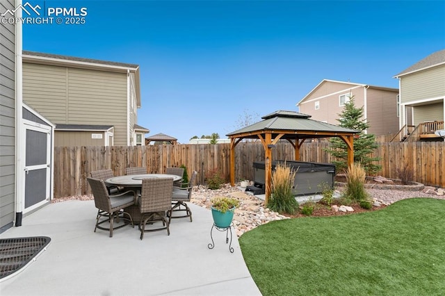 view of patio / terrace with a gazebo and a hot tub