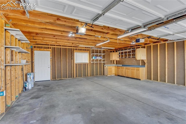 garage featuring a garage door opener