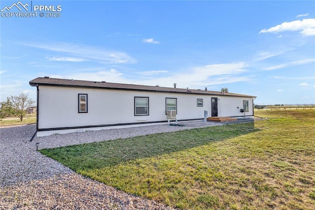 back of property featuring a lawn and a patio