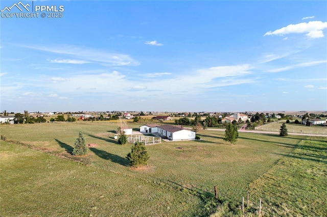 birds eye view of property with a rural view