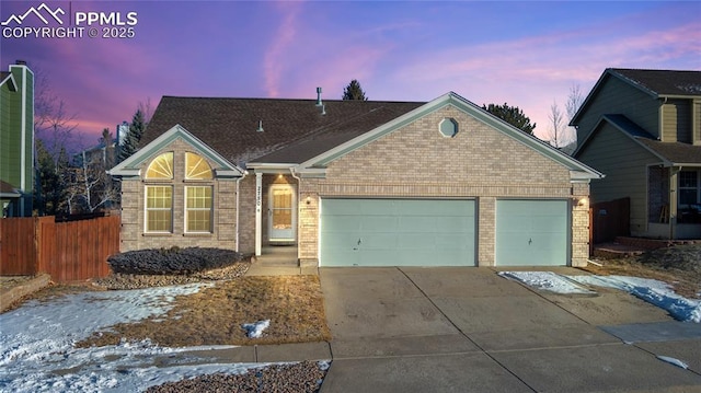 view of front of property featuring a garage