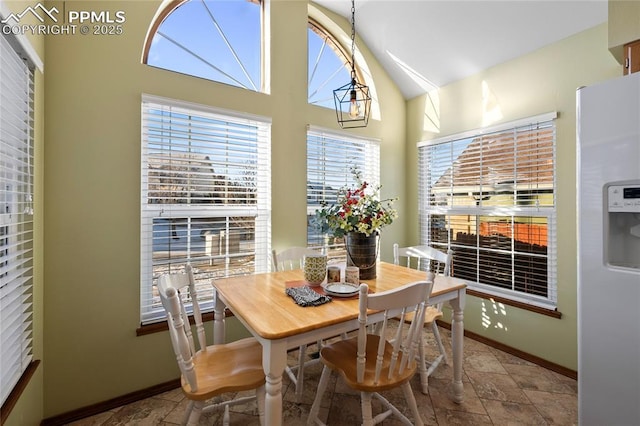 dining room with lofted ceiling