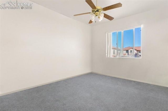 carpeted spare room with ceiling fan