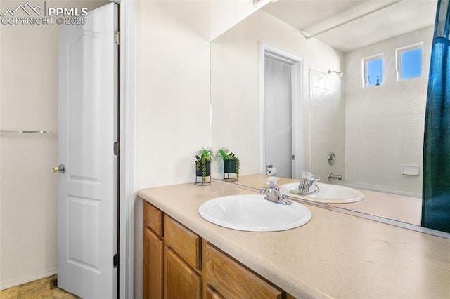 bathroom with vanity and bathing tub / shower combination