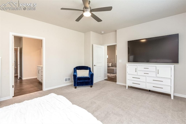 carpeted bedroom with ceiling fan and connected bathroom