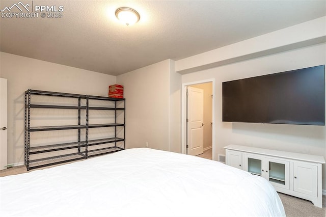 unfurnished bedroom featuring a textured ceiling and light carpet