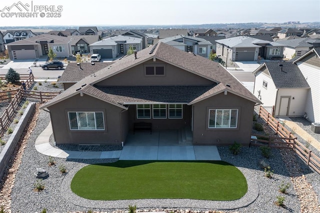 rear view of property featuring a lawn, a patio area, and central AC unit