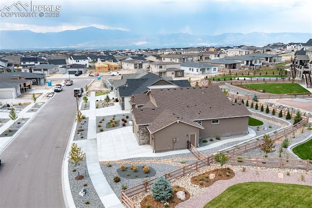 birds eye view of property with a mountain view