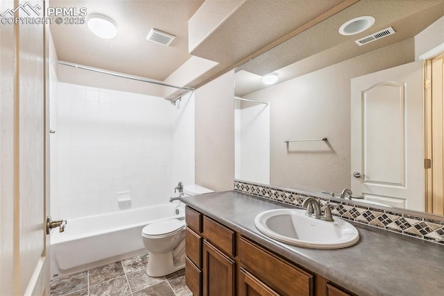 full bathroom with bathtub / shower combination, a textured ceiling, vanity, and toilet