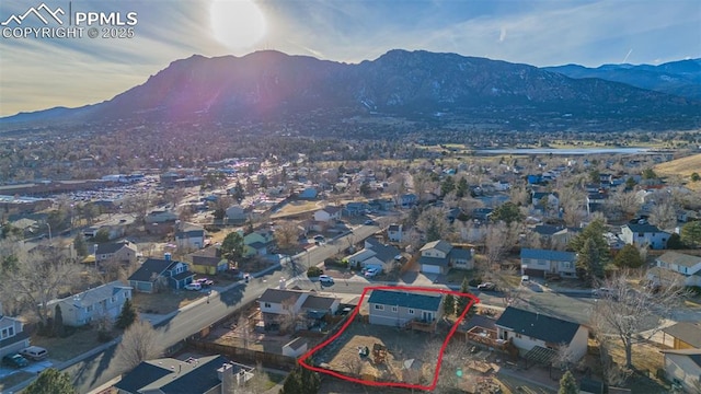 birds eye view of property with a mountain view