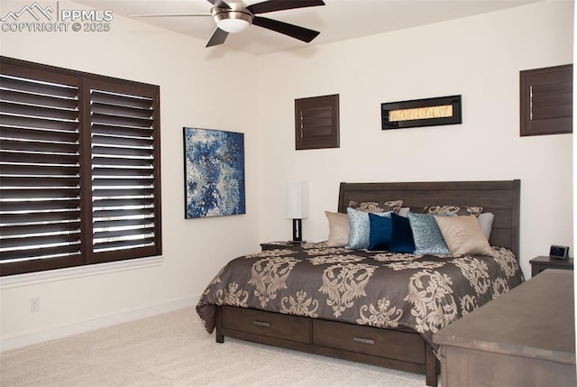 bedroom featuring ceiling fan and light colored carpet