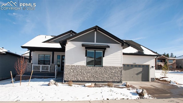 view of front of home featuring a porch and a garage