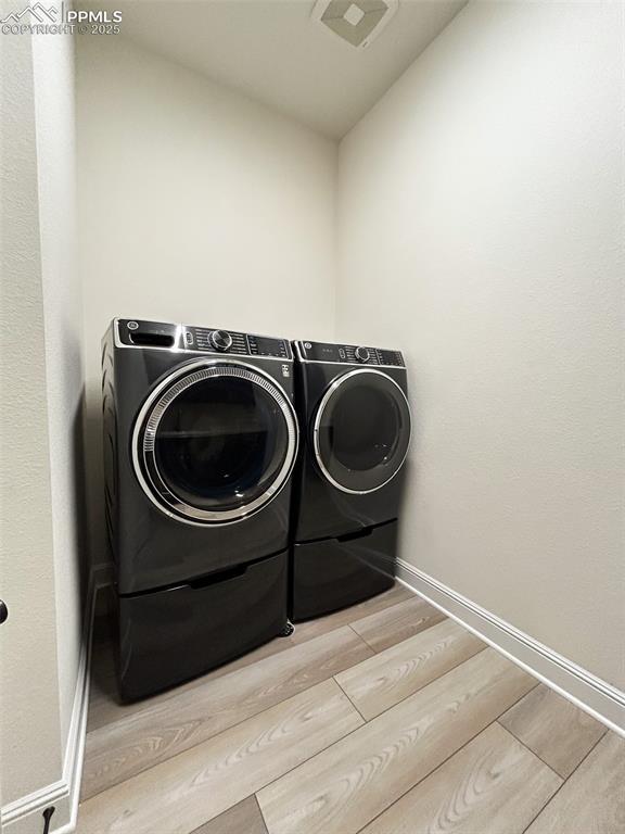 laundry room with washer and clothes dryer