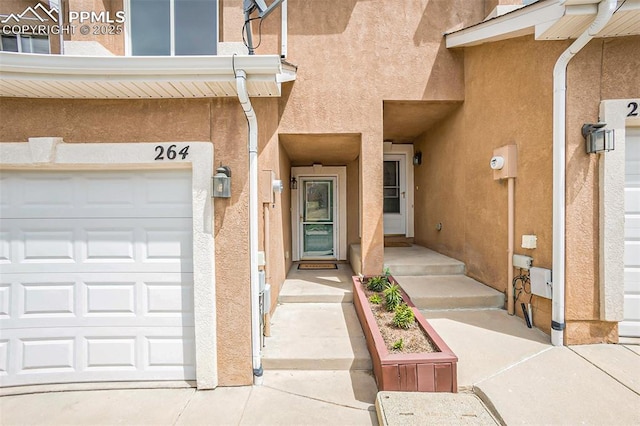 entrance to property featuring a garage