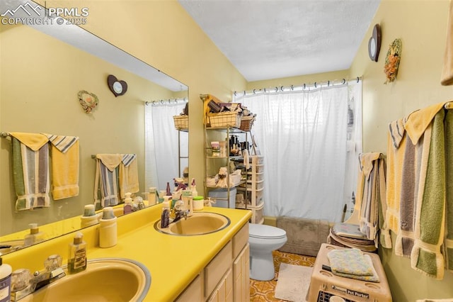 full bathroom featuring vanity, toilet, and shower / bath combo with shower curtain