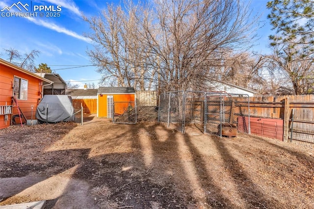 view of yard with a storage unit