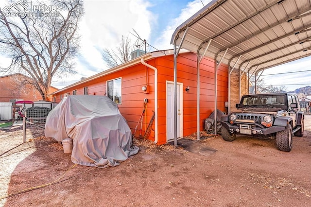 view of outdoor structure with a carport