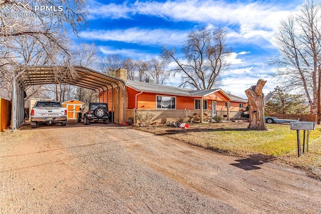 single story home featuring a carport