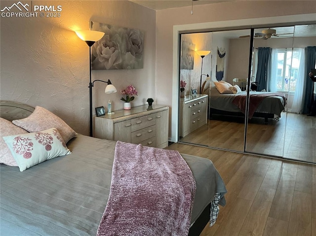 bedroom with light hardwood / wood-style flooring and a closet