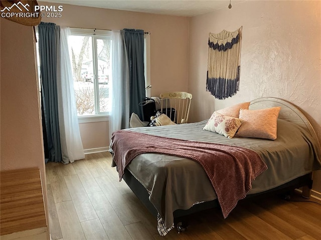 bedroom featuring hardwood / wood-style floors