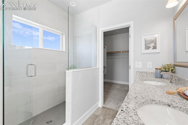 bathroom featuring vanity and walk in shower