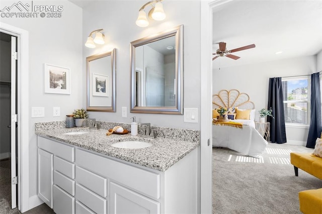 bathroom with ceiling fan and vanity