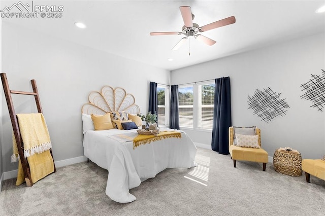 bedroom featuring ceiling fan and light colored carpet