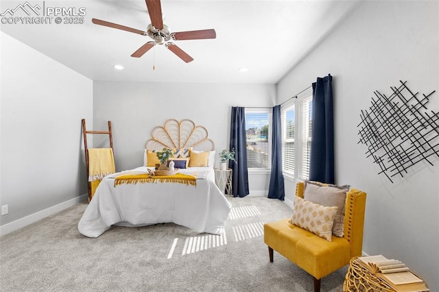 bedroom featuring light colored carpet and ceiling fan