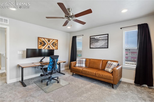 office featuring ceiling fan and light colored carpet