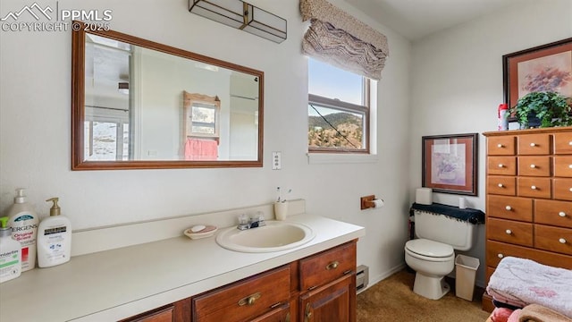 bathroom featuring vanity and toilet