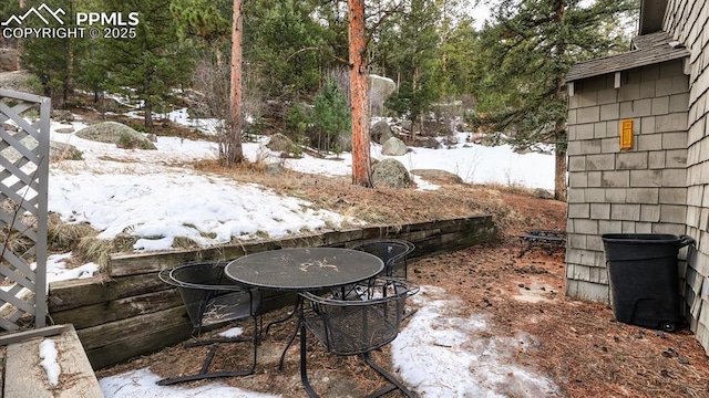 view of yard layered in snow