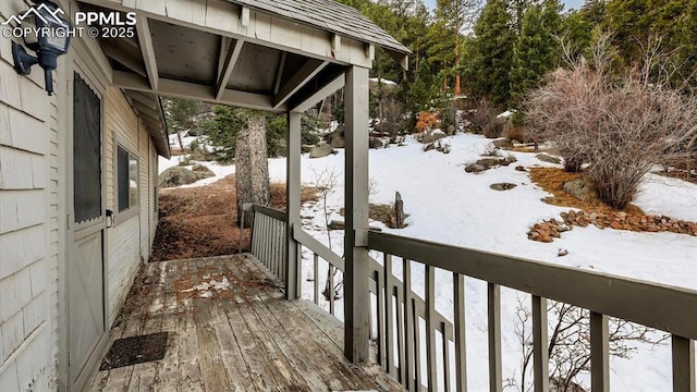 view of snow covered deck