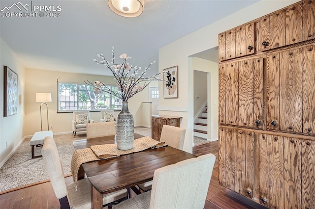 dining room with dark hardwood / wood-style flooring