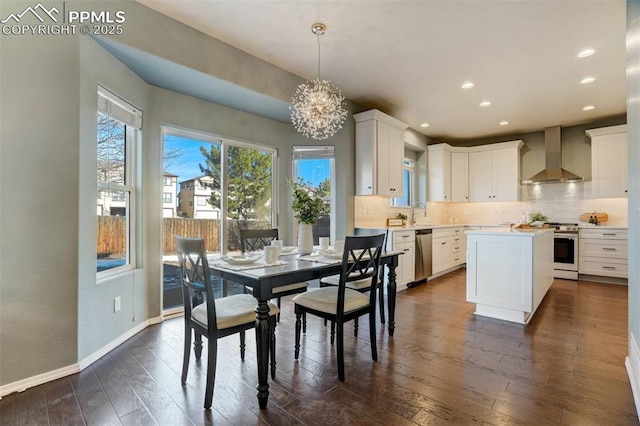 dining area with dark hardwood / wood-style floors and a chandelier