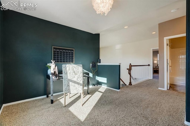 hall with carpet and a chandelier