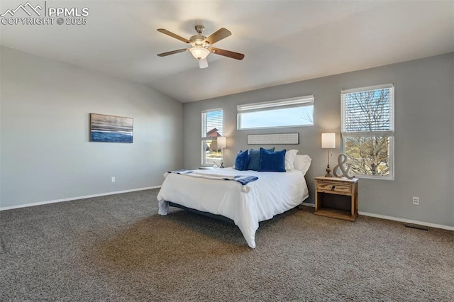 bedroom with ceiling fan, carpet flooring, multiple windows, and lofted ceiling