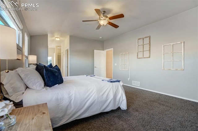 carpeted bedroom featuring ceiling fan and ensuite bathroom